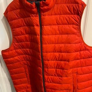 Red- orange vest with tags